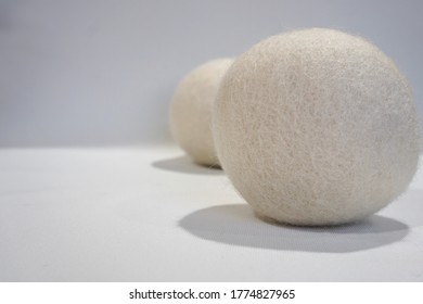 Two Wool Dryer Ball With White Background.