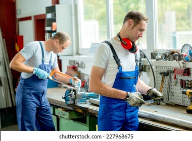Two Worker On Work Bench