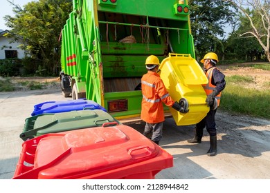 Two Workers Collecting Garbage Of Urban Municipal Are Collecting For Trash Removal. Garbage Collector.