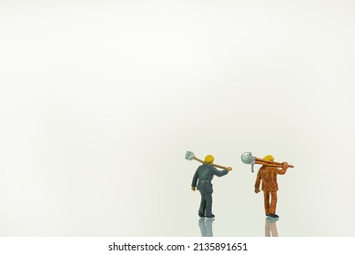 two workers with shovels isolated on white background