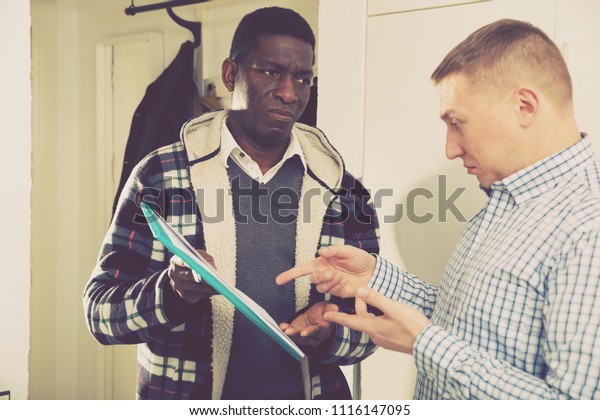 Two Worried Men Documents Having Conflict Stock Photo (Edit Now) 1116147095