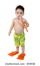 Two Year Old Boy Dressed In Colorful Swim Trunks With Orange Flippers And A Snorkel.