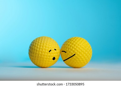 
Two Yellow Balls Showing Emotions On Blue Background. Resilience Concept.