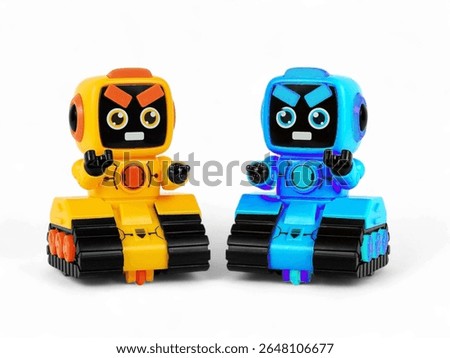 Two yellow and blue mini robot toy isolated on the white background