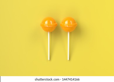 Two Yellow Lolipop On Yellow Pastel Stock Photo (Edit Now) 1447414166