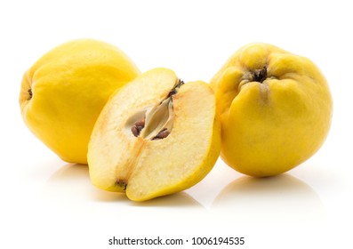 Two yellow quinces with one half isolated on white background raw ripe