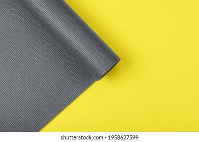 Two Yoga Mats In Fashionable Colors Illuminating Yellow And Gray Shot From Above Close Up