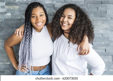 Two young afro girls having fun together, joy, positive, love, friendship