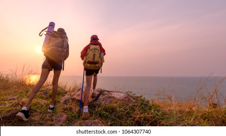 Two young Asian female hipster hiking on mountain holiday, wild adventure. Background for Travel concept 