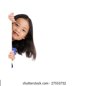 Two Young Asian Girls Holding A Blank White Sign. Put Your Education Message Here.