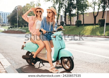 Similar – Image, Stock Photo Stylish fashion girl with cool hairstyle and blue shirt showing heart with fingers on yellow background