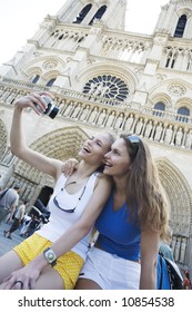 Two Young Beautiful Woman Are Visiting Paris In Summer With Bicycle