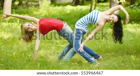 two young beautiful women having fun outdoor
