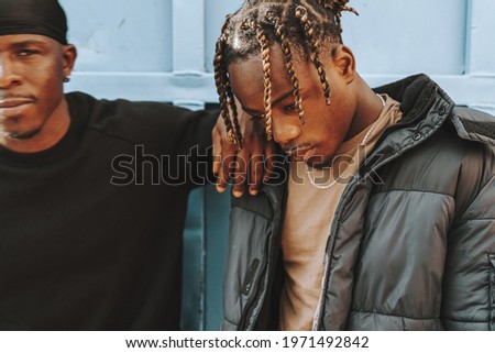 Similar – Black young man listening to music in a sunny day