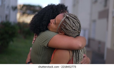 Two young black women hugging each other. Adult girlfriends embrace. People empathic hug - Shutterstock ID 2218452773