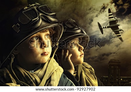 Two young boy soldiers looking at the skies