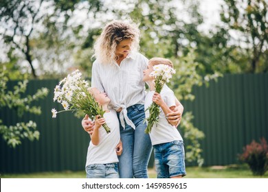 https://image.shutterstock.com/image-photo/two-young-boys-give-flowers-260nw-1459859615.jpg