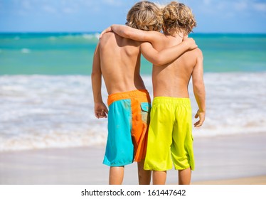 Two Young Boys Having Fun On Tropical Beach, Happy Best Friends Playing, Friendship Concept