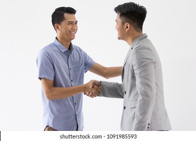 Two Young Business Man Make A Deal With Hand Shaking