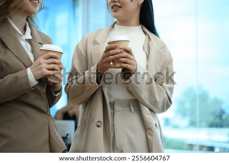 Similar – Image, Stock Photo Businesswoman enjoying coffee break in a modern cafeteria