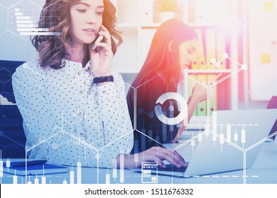 Two Young Businesswomen Working With Smartphones And Laptops In Modern Office With Double Exposure Of Business Interface. Concept Of Computer Science And Big Data. Toned Image