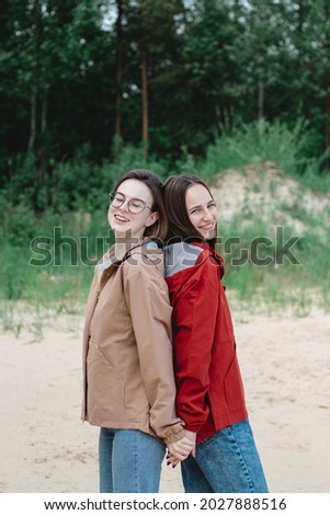 Similar – Image, Stock Photo happy twin sisters stand back to back