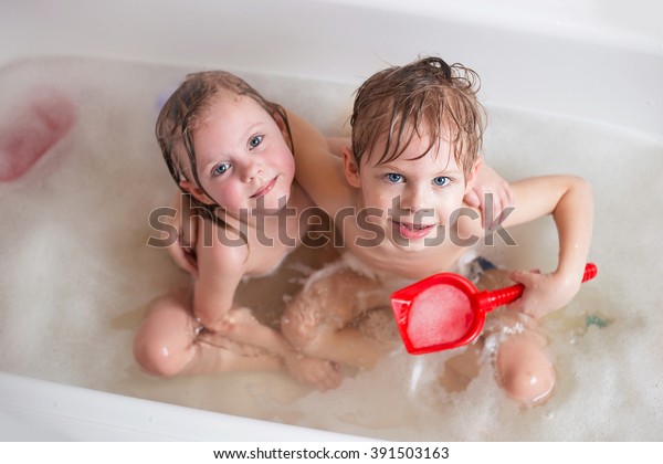 boy and girl bathing