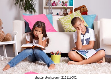 Two Young Children Sick Of Learning