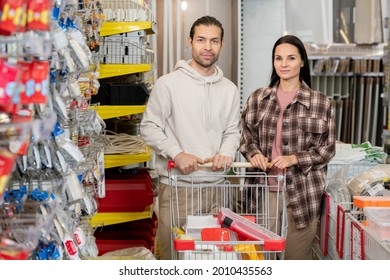 Two Young Consumers With Shopping Cart Visiting Hardware Store