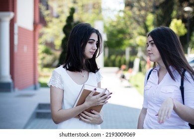 Two Young Female Students Talking About Problems During Their Studies, Hardships, Sharing Feelings.