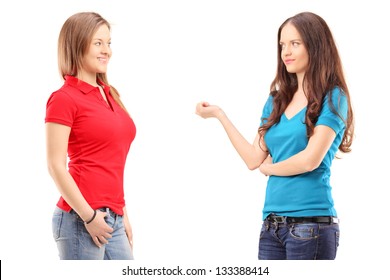 Two young females having a conversation, isolated on white background