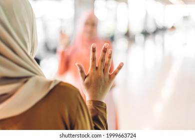 Two Young Friend Beauty Islamic Asian Arabic Muslim Woman Wearing A Hijab Enjoying And Having Fun Talking Together Waving Hi And Saying Hello In The Shop At Fashion Store