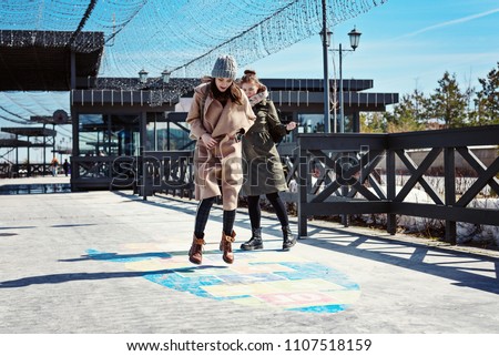 Similar – Couple of tourists walking down the street