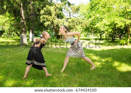 Two young girls having fun. They are sisters.
