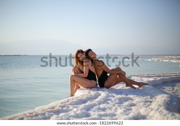 Nude babes are having some good time on the beach
