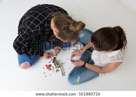 Similar – Baby Mädchen spielt mit Haarspangen, die auf dem Boden sitzen.