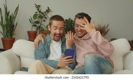 Two Young Lgbt Guys Are Talking News About Their Wedding To Their Relatives On The Video Call