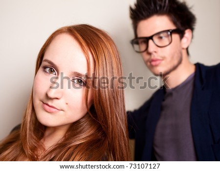 Similar – Young couple posing with funny faces