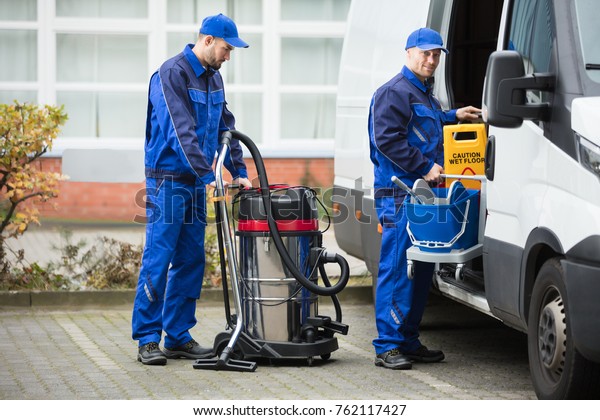 Two Young Male Janitor Blue Uniform Stock Photo (Edit Now) 762117427