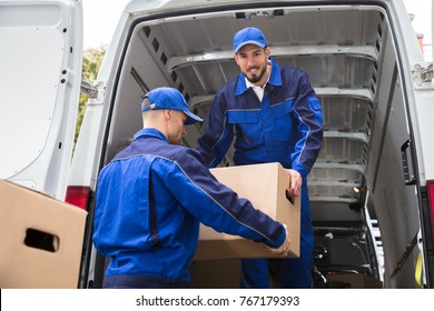 Two Young Male Movers Carrying Cardboard Stock Photo 767179393 ...