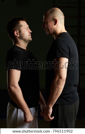 Two young man looking face to  face. Box sportmens before fight