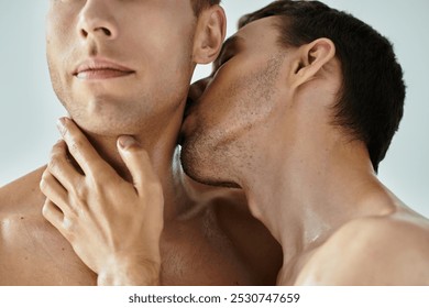 Two young men express affection with a gentle kiss, radiating love and intimacy.