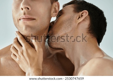 Two young men express affection with a gentle kiss, radiating love and intimacy.