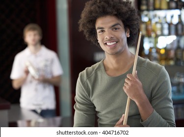 Two Young Men Playing Pool