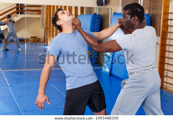 Two Young Men Practicing Self Defense Stock Photo Edit Now