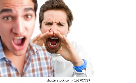 two young men shouting - Shutterstock ID 162707729