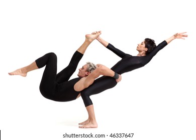 Two Young Modern Acrobats Posing On White