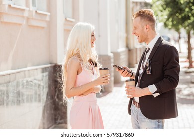 Two Young People Exchanging Phone Numbers. Love Story Concept.