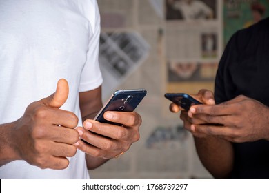 Two Young People Successfully, Share Content Via Their Mobile Phones