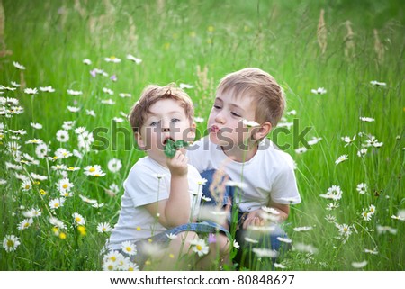 Similar – Vater und Sohn sitzen im Park.